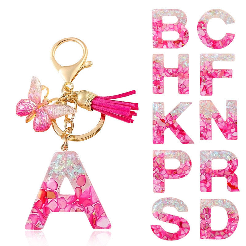 Hot pink glitter resin initial keychain with butterfly charm and tassel – cute personalized bag accessory