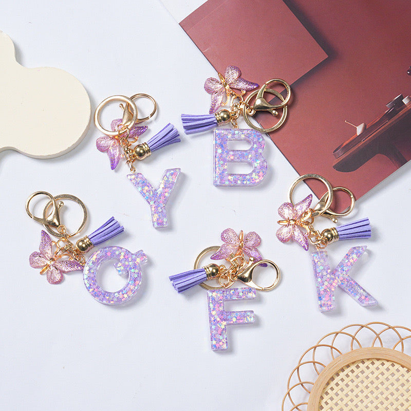 Purple Glitter Resin Initial Keychain – Butterfly & Tassel Charm Gift