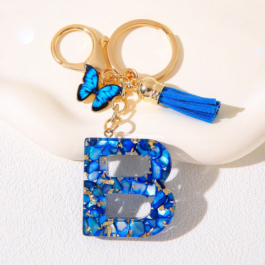 Blue Glitter Resin Initial Keychain – Butterfly & Tassel Charm