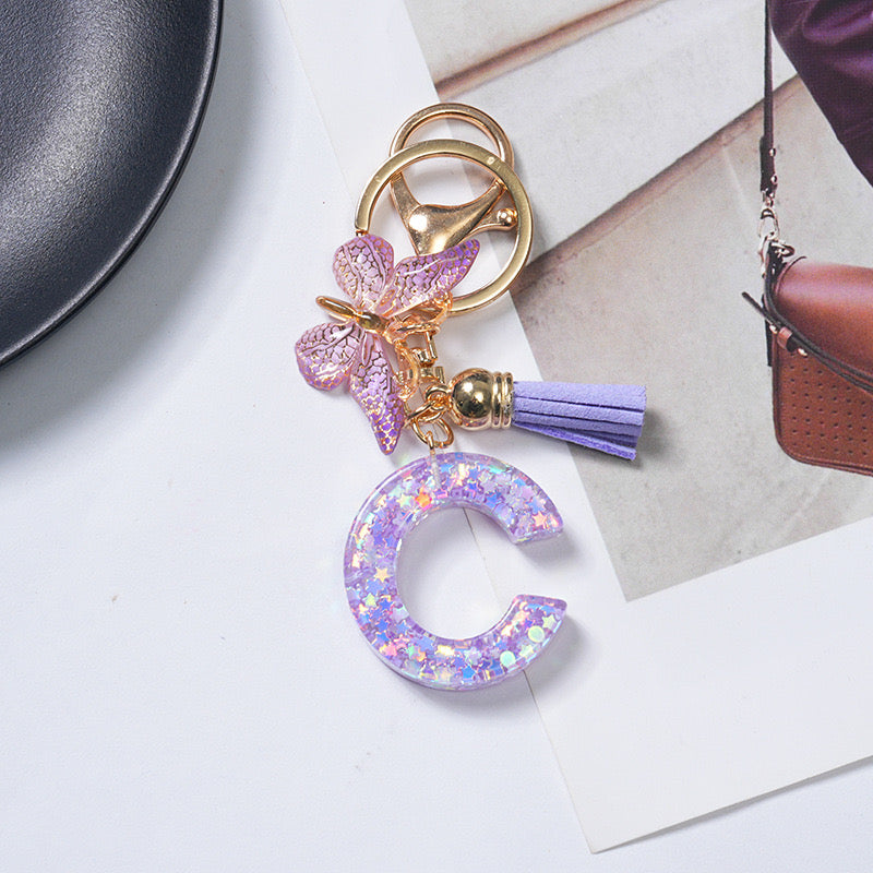 Purple Glitter Resin Initial Keychain – Butterfly & Tassel Charm Gift