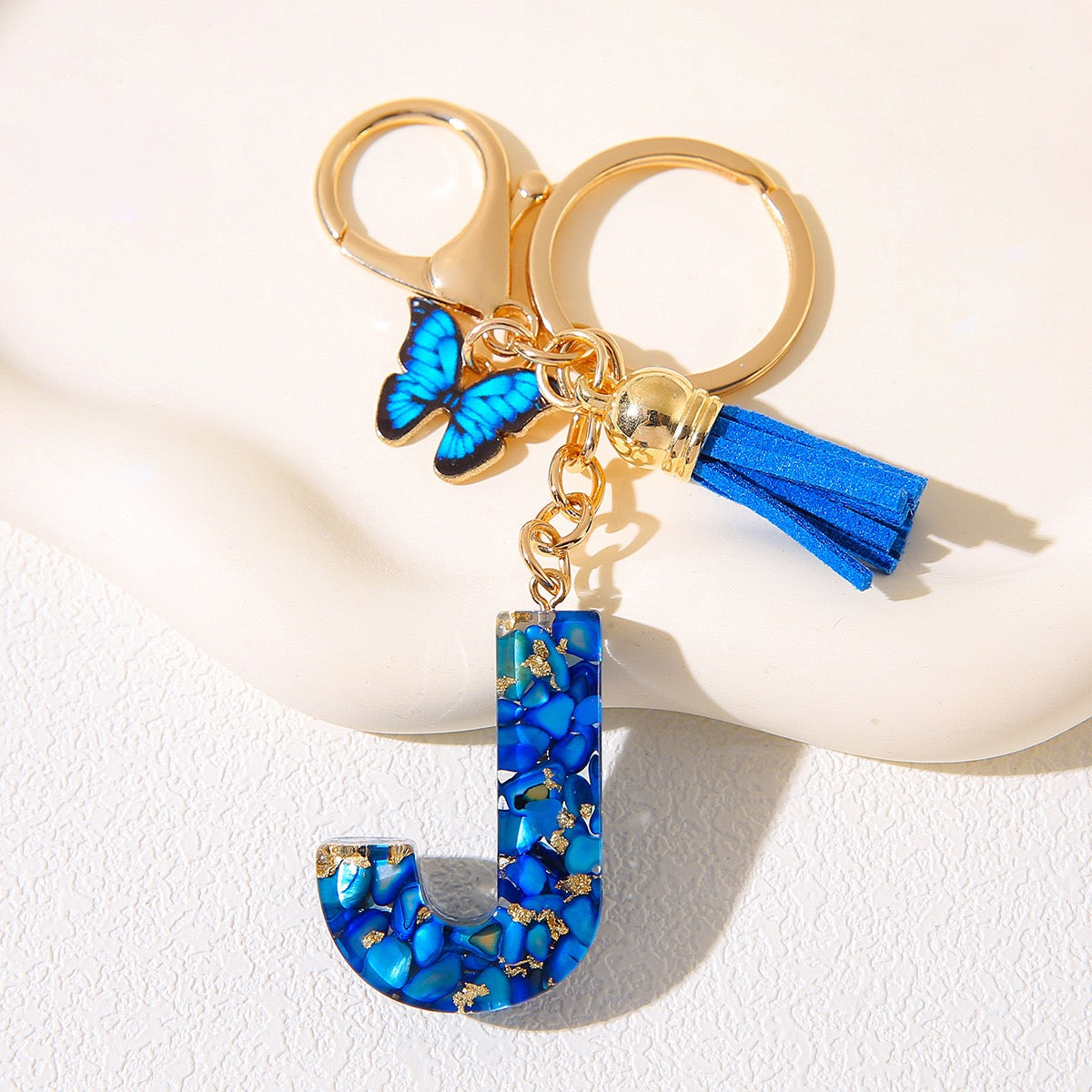 Blue Glitter Resin Initial Keychain – Butterfly & Tassel Charm