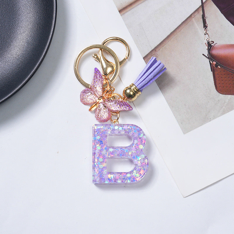 Purple Glitter Resin Initial Keychain – Butterfly & Tassel Charm Gift