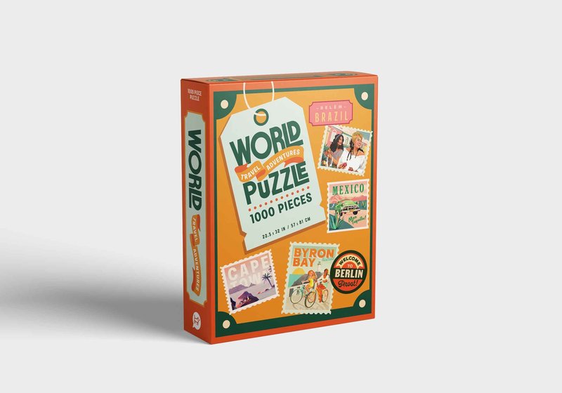 Colorful 1000-piece jigsaw puzzle titled “World Puzzle – Travel Adventures”, featuring vintage travel-themed stamp illustrations of destinations like Brazil, Mexico, Cape Town, Byron Bay, and Berlin on a retro orange box.