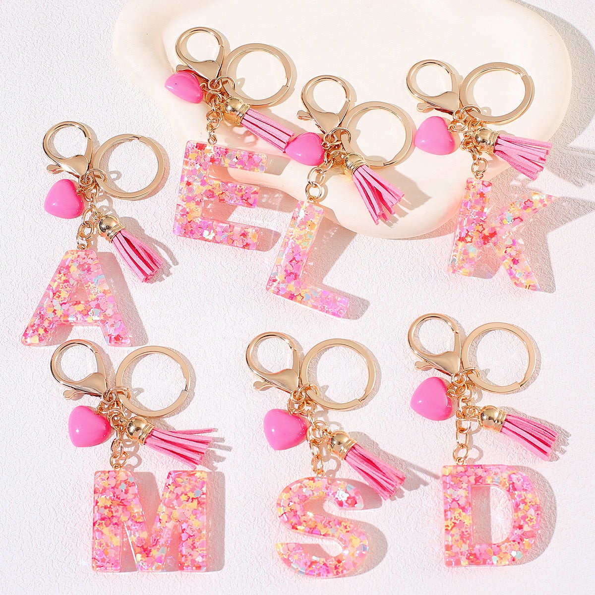Pink glitter resin initial keychain with heart and tassel charm, cute personalized gift for girls or teens