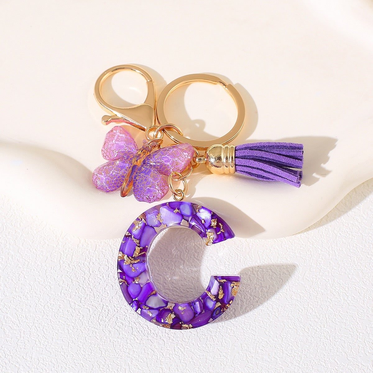 Glitter Letter Keychain – Purple Resin with Butterfly & Tassel