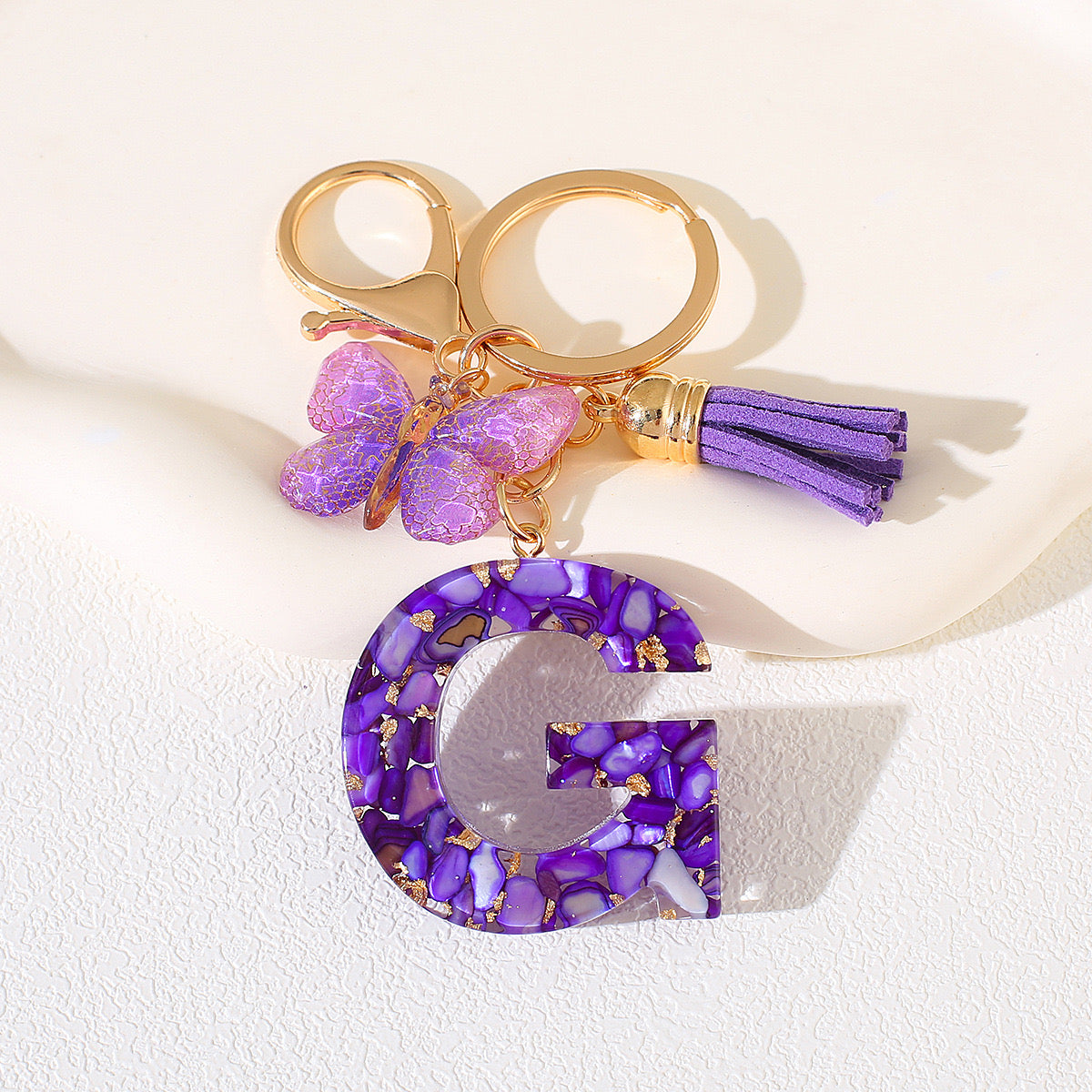 Glitter Letter Keychain – Purple Resin with Butterfly & Tassel
