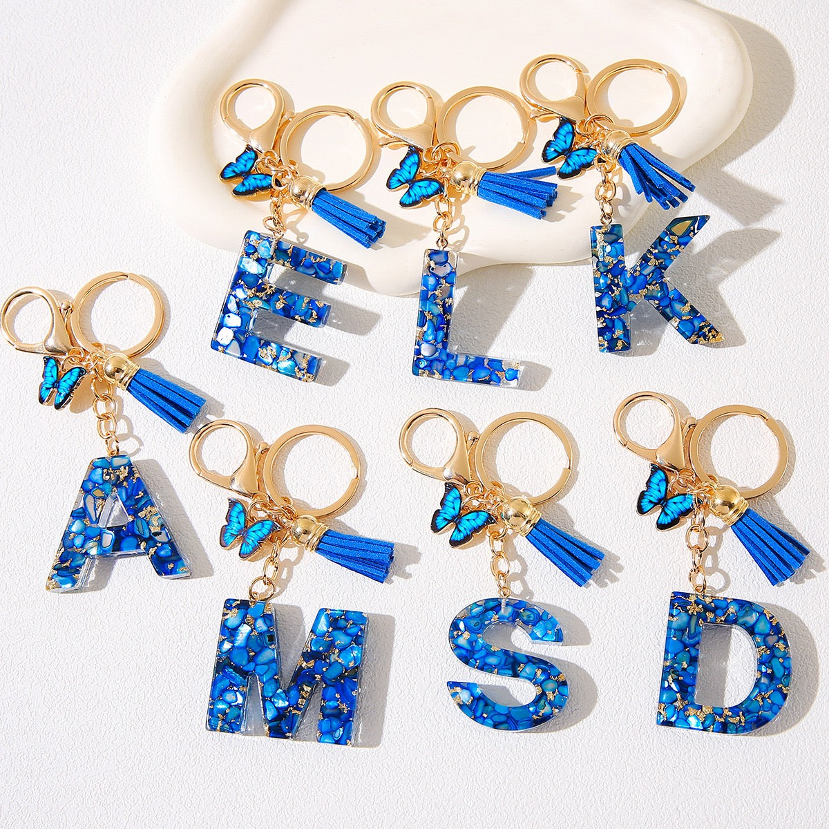 Blue Glitter Resin Initial Keychain – Butterfly & Tassel Charm