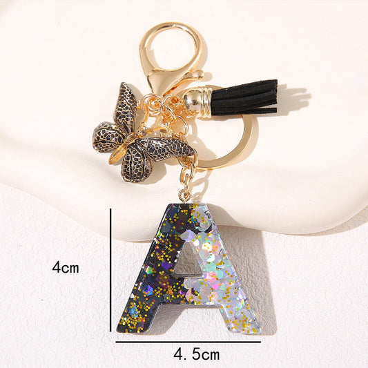 Black Glitter Resin Initial Keychain – Butterfly & Tassel Charm