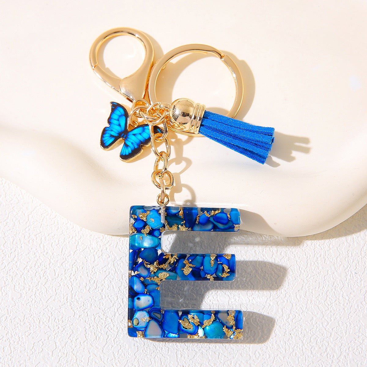 Blue Glitter Resin Initial Keychain – Butterfly & Tassel Charm