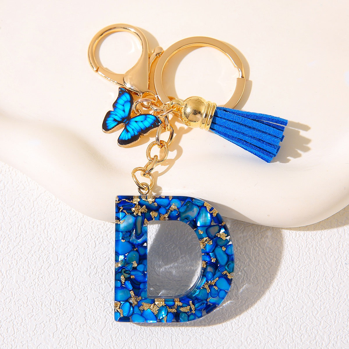 Blue Glitter Resin Initial Keychain – Butterfly & Tassel Charm