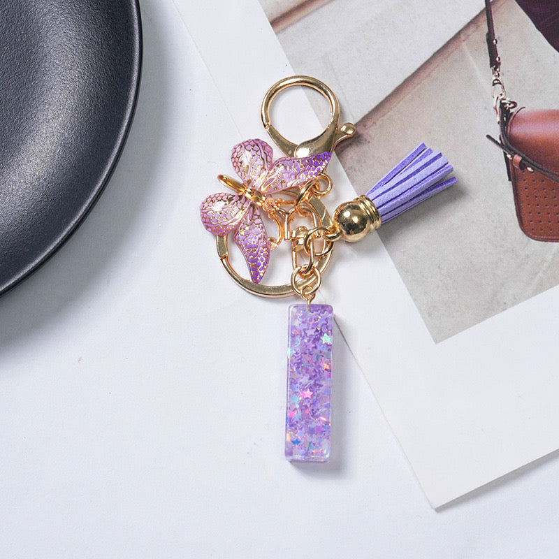 Purple Glitter Resin Initial Keychain – Butterfly & Tassel Charm Gift