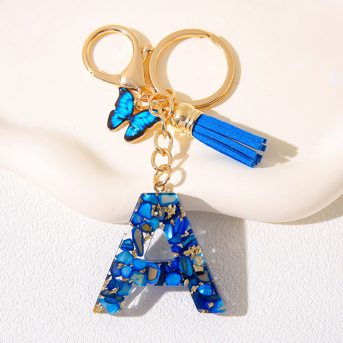Blue Glitter Resin Initial Keychain – Butterfly & Tassel Charm