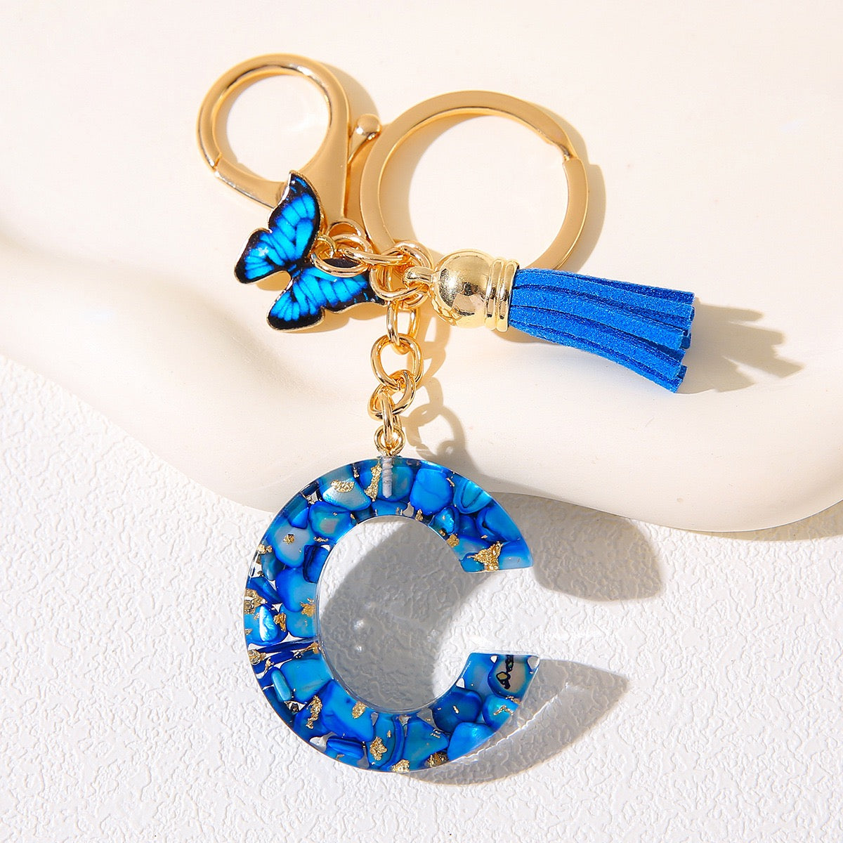 Blue Glitter Resin Initial Keychain – Butterfly & Tassel Charm