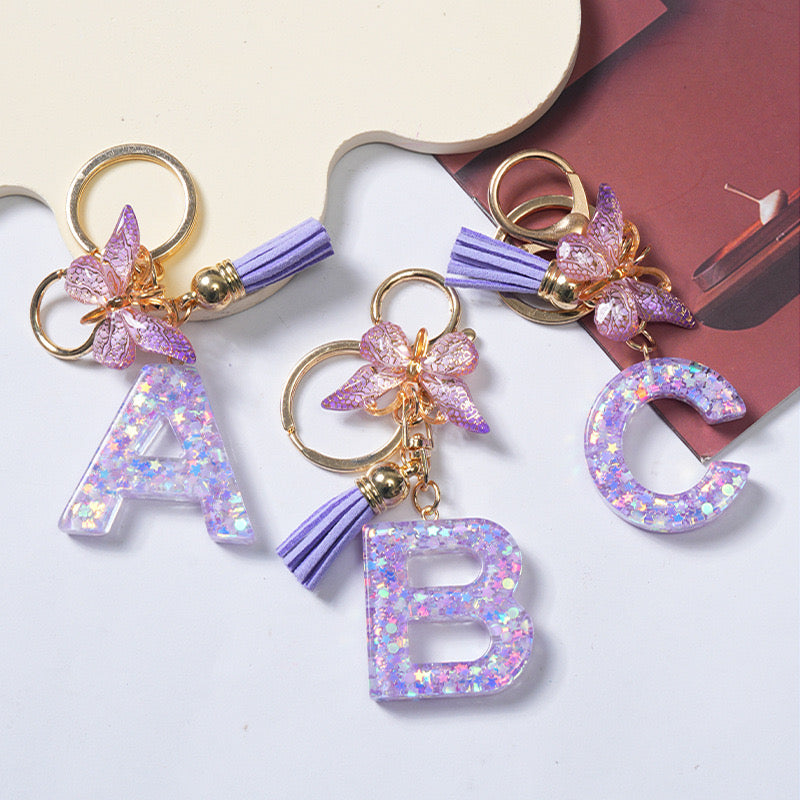 Purple Glitter Resin Initial Keychain – Butterfly & Tassel Charm Gift