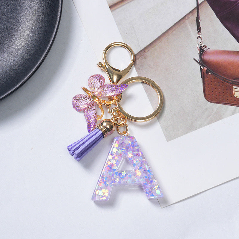 Purple Glitter Resin Initial Keychain – Butterfly & Tassel Charm Gift