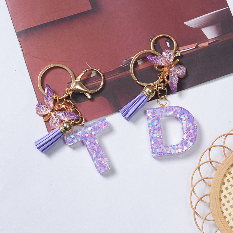Purple Glitter Resin Initial Keychain – Butterfly & Tassel Charm Gift