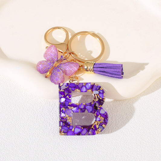 Glitter Letter Keychain – Purple Resin with Butterfly & Tassel