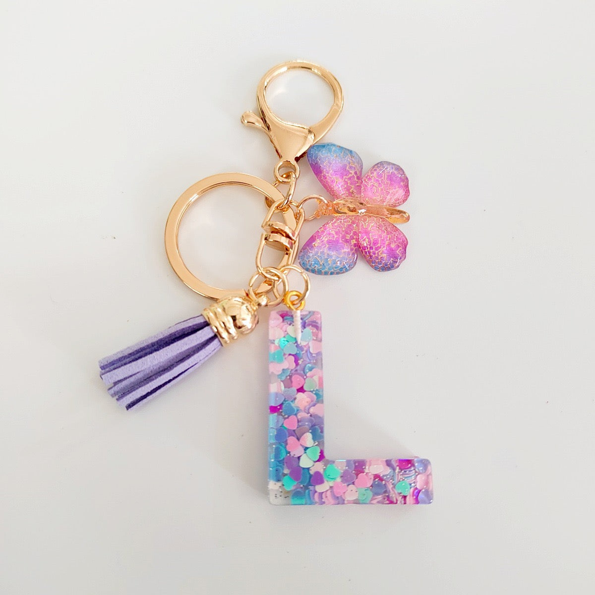Glitter Resin Letter Keychain – Purple Tassel & Butterfly Charm