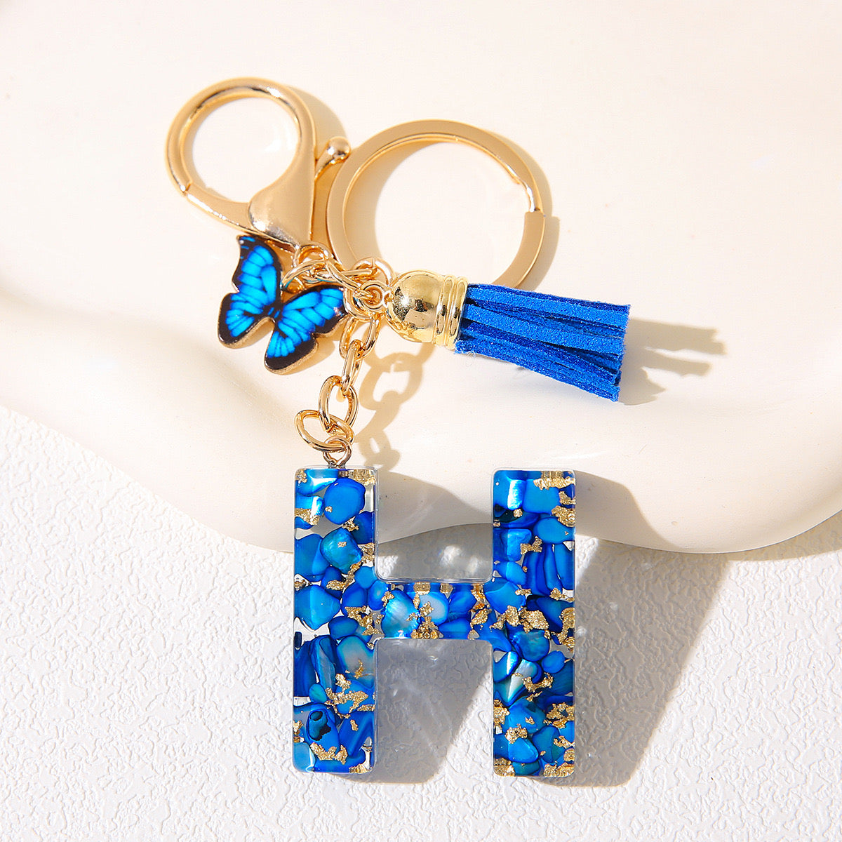 Blue Glitter Resin Initial Keychain – Butterfly & Tassel Charm