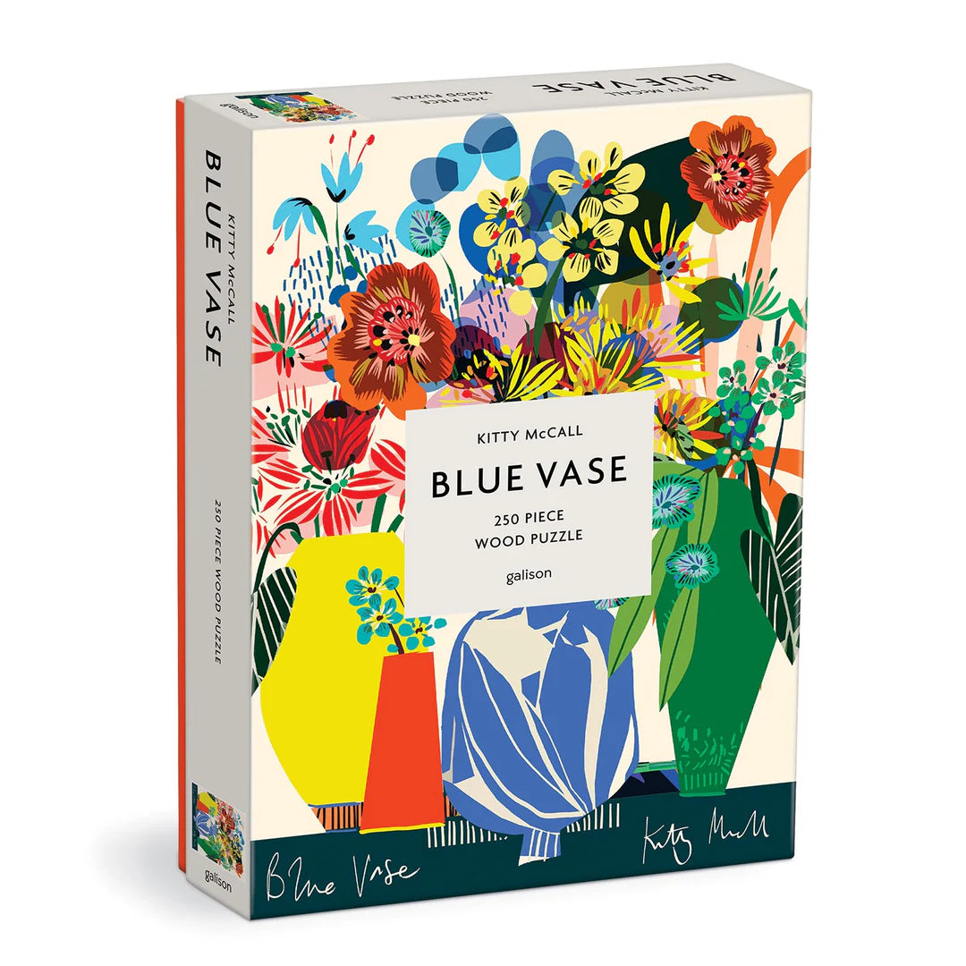 Blue Vase 250-piece wooden puzzle by Galison featuring a colorful modern floral illustration by Kitty McCall with abstract flowers in a blue vase.