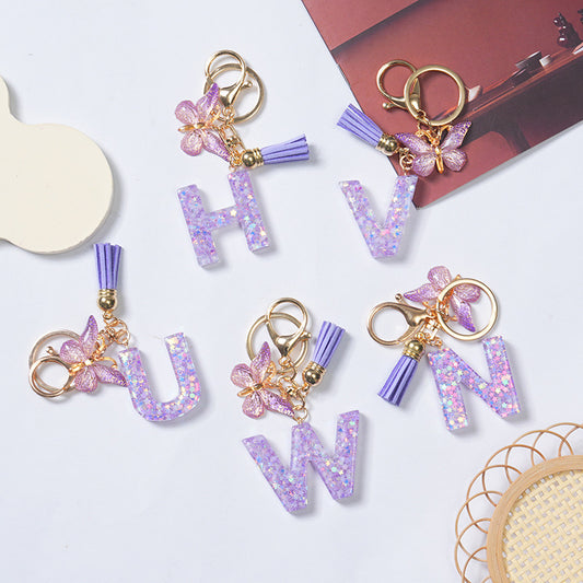 Purple glitter resin initial keychains with pink butterfly charm and tassel – personalized gift for her