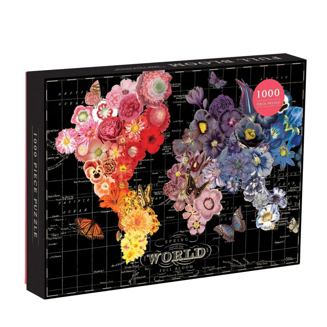 Wendy Gold Full Bloom 1000-piece jigsaw puzzle featuring a world map formed by vibrant, blooming flowers on a black background.