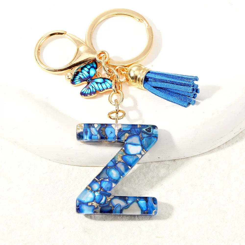 Blue Glitter Resin Initial Keychain – Butterfly & Tassel Charm