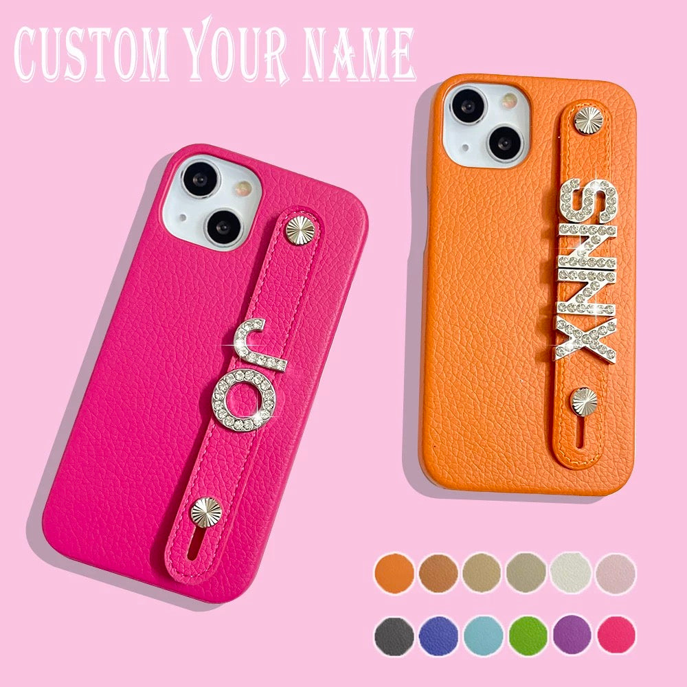Personalized leather phone case with custom rhinestone letters and strap handle