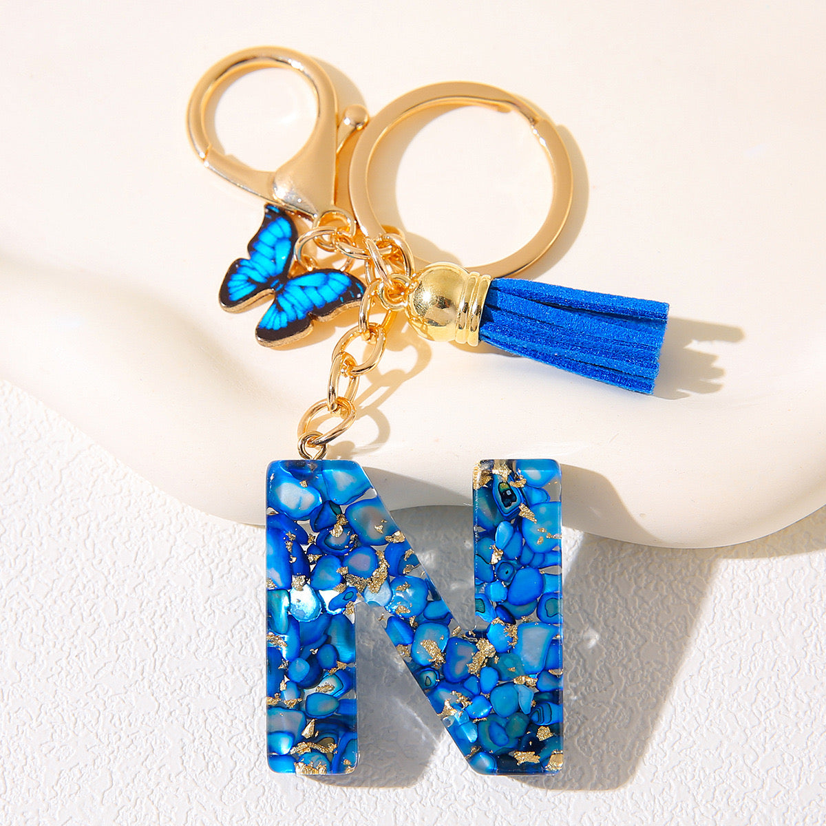 Blue Glitter Resin Initial Keychain – Butterfly & Tassel Charm