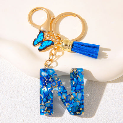 Blue Glitter Resin Initial Keychain – Butterfly & Tassel Charm