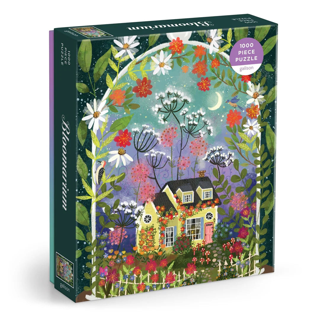 Joy Laforme Bloomarium 1000-piece puzzle featuring a whimsical floral conservatory with colorful flowers, glass walls, and dreamy garden details.