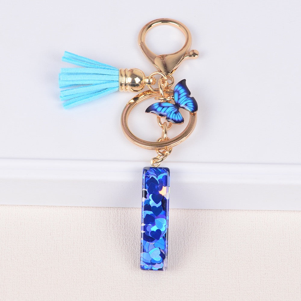 Blue Initial Letter Keychain with Butterfly & Tassel V Boutique Studio