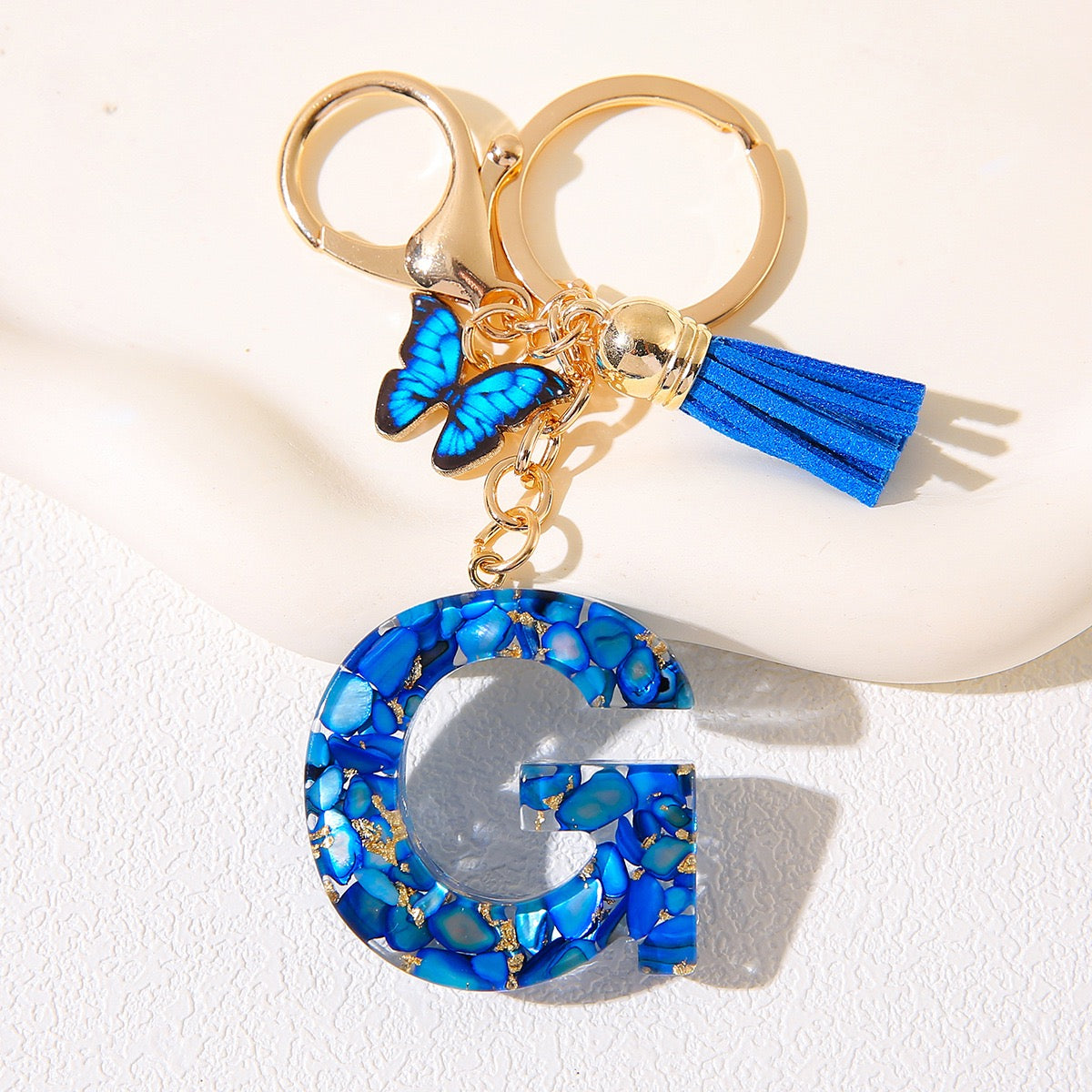 Blue Glitter Resin Initial Keychain – Butterfly & Tassel Charm
