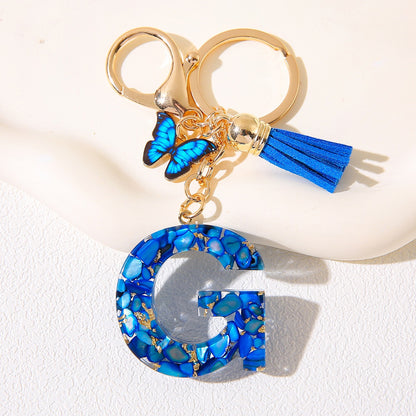 Blue Glitter Resin Initial Keychain – Butterfly & Tassel Charm