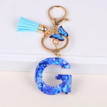 Blue Initial Letter Keychain with Butterfly & Tassel V Boutique Studio