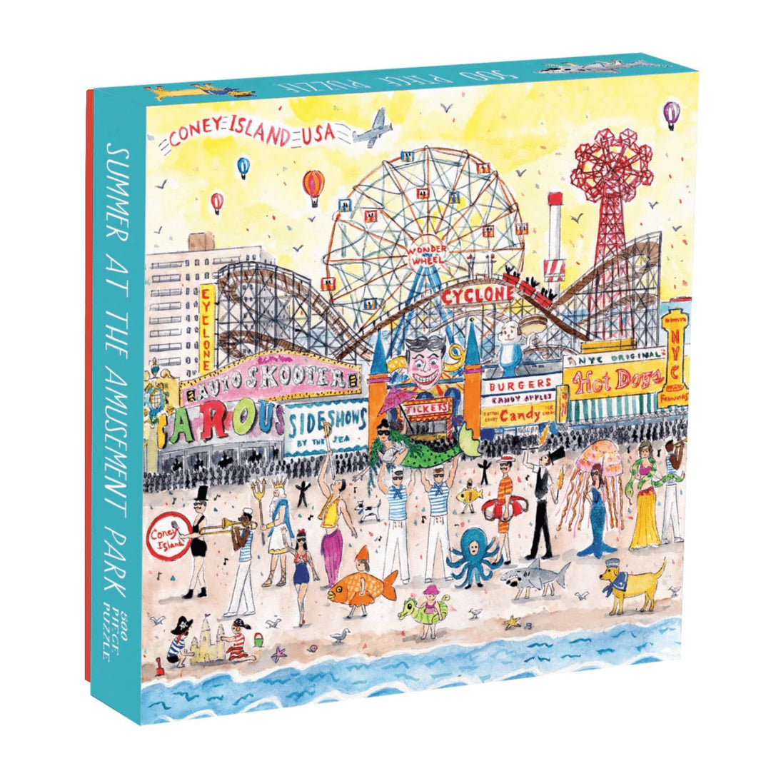 Summer at the Amusement Park 500-piece puzzle by Galison featuring a whimsical illustrated scene of Coney Island with roller coasters, ferris wheel, beachgoers, and colorful signage.