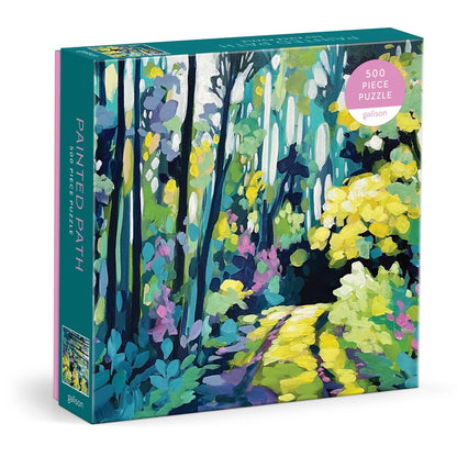 Painted Path 500-piece puzzle featuring a whimsical illustrated trail through a colorful forest with trees, hills, and a winding path.
