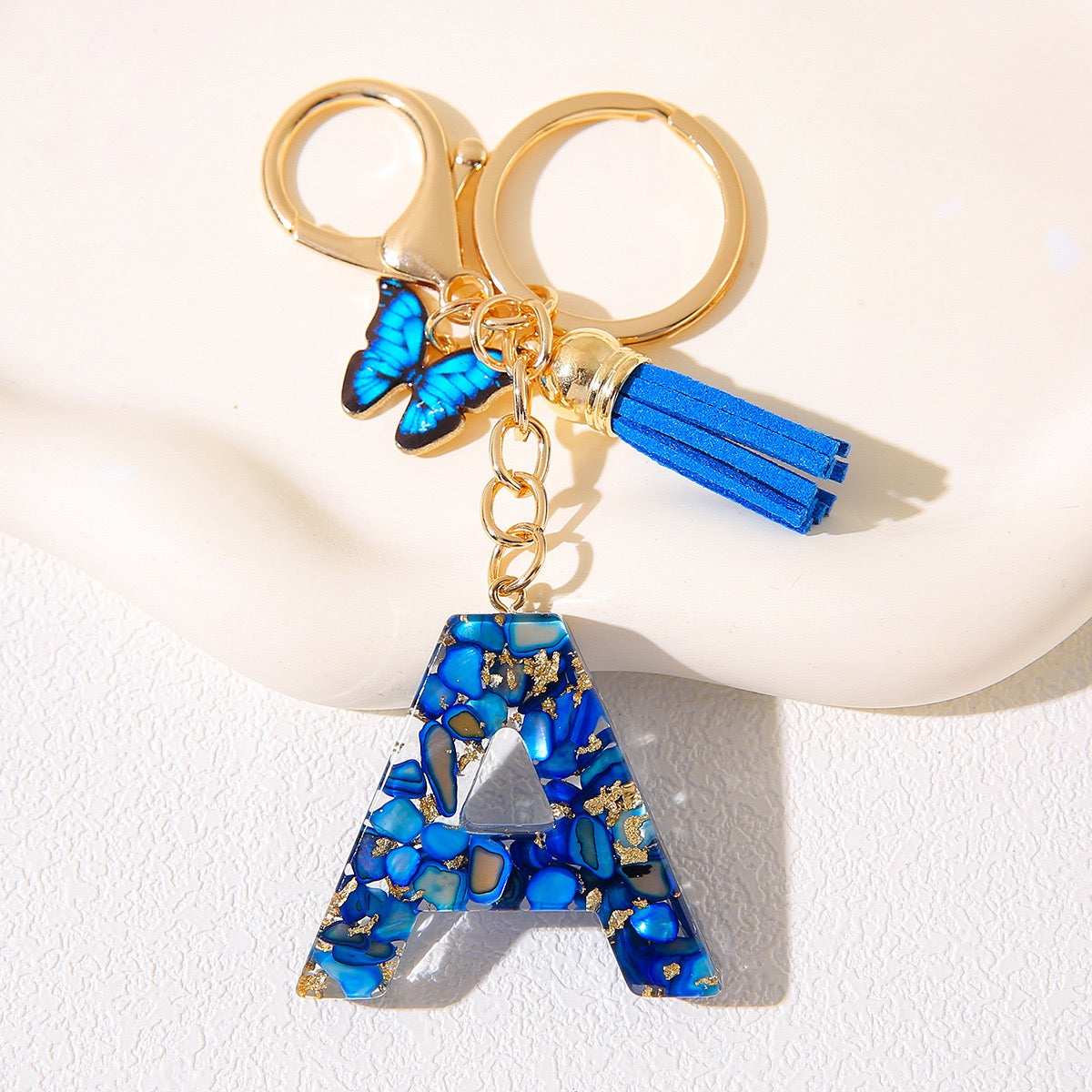 Blue Glitter Resin Initial Keychain – Butterfly & Tassel Charm
