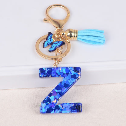 Blue Initial Letter Keychain with Butterfly & Tassel V Boutique Studio