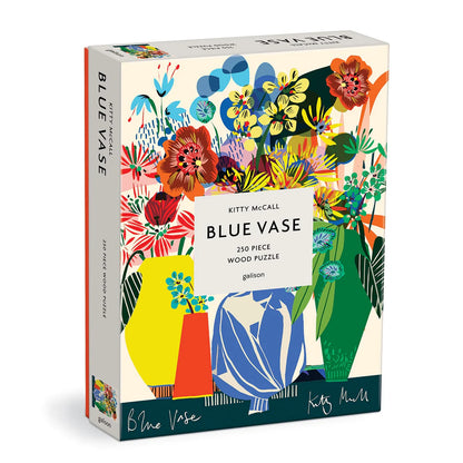 Blue Vase 250-piece wooden puzzle by Galison featuring a colorful modern floral illustration by Kitty McCall with abstract flowers in a blue vase.