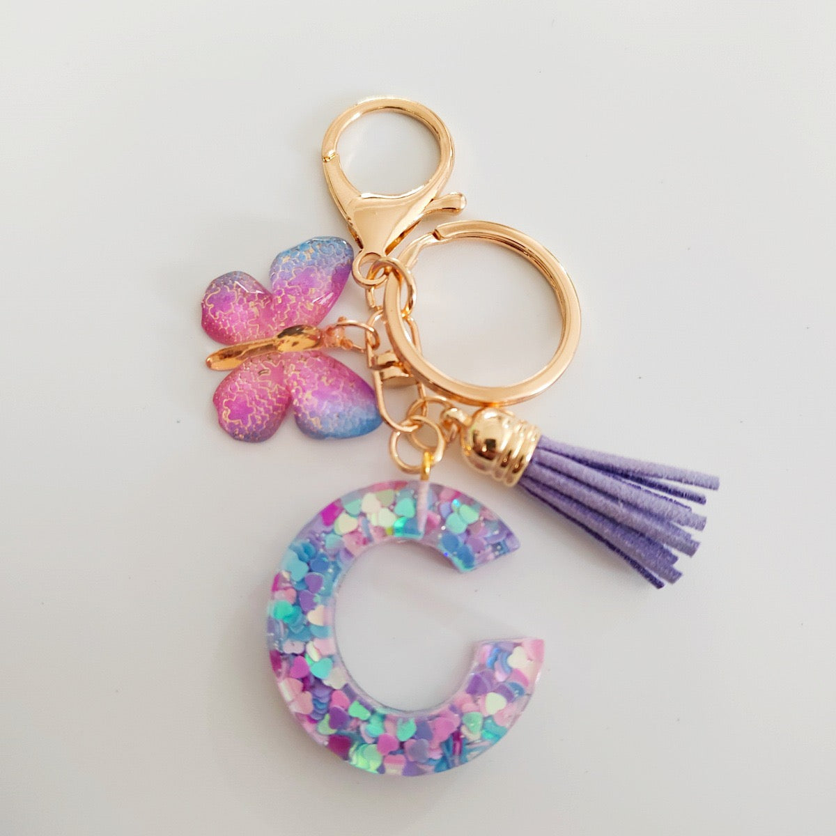 Glitter Resin Letter Keychain – Purple Tassel & Butterfly Charm
