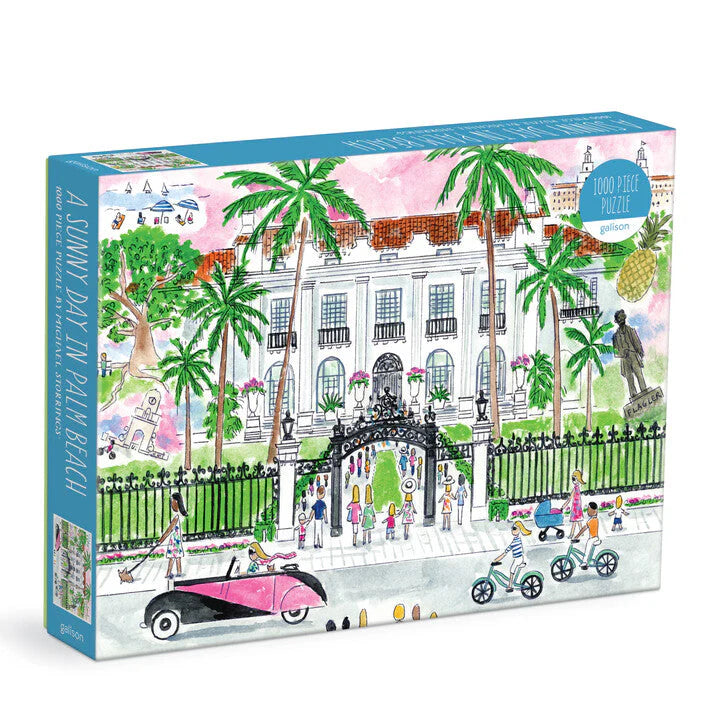 A Sunny Day in Palm Beach 1000-piece puzzle by Galison illustrated by Michael Storrings, featuring a stately mansion, palm trees, classic cars, and people strolling or cycling.