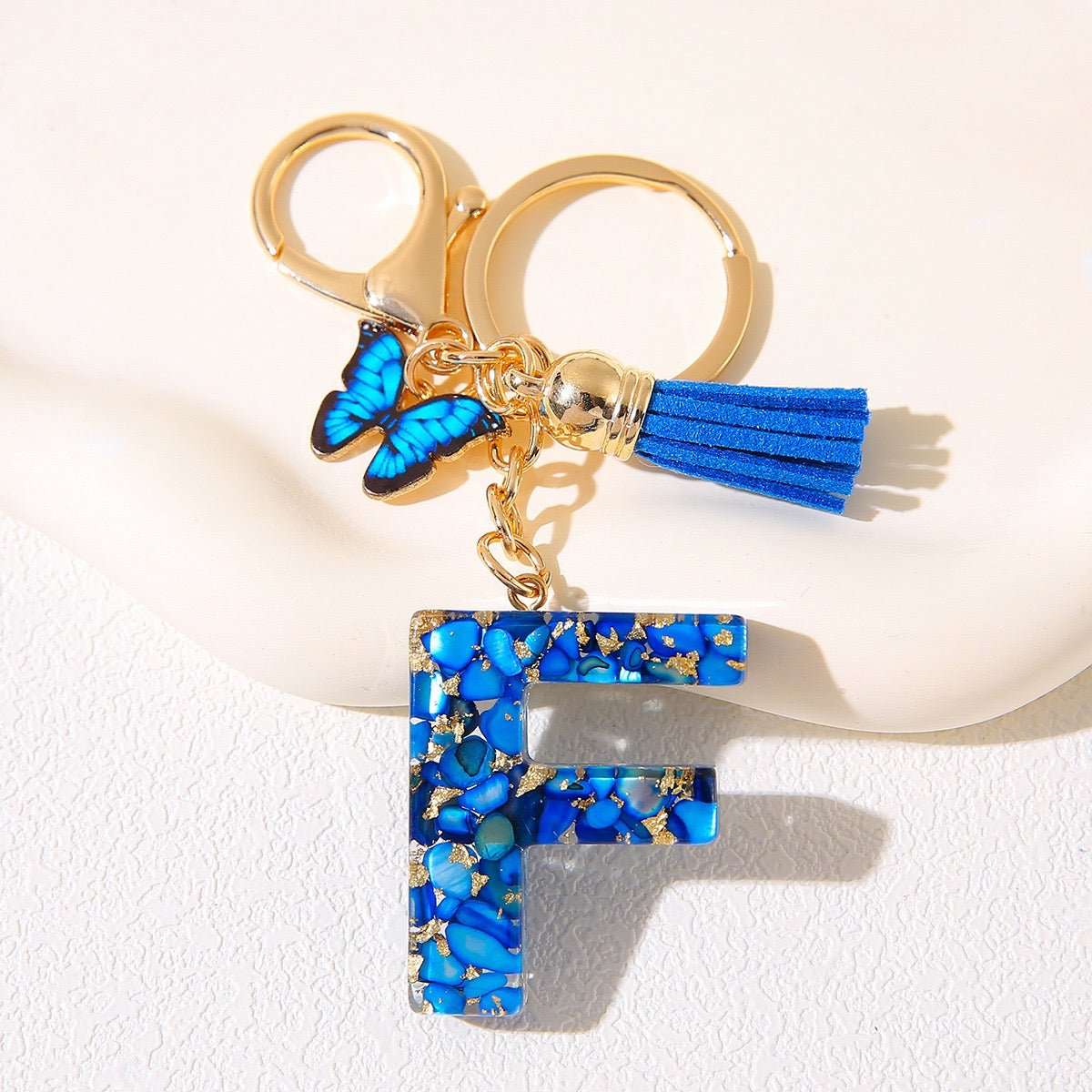 Blue Glitter Resin Initial Keychain – Butterfly & Tassel Charm