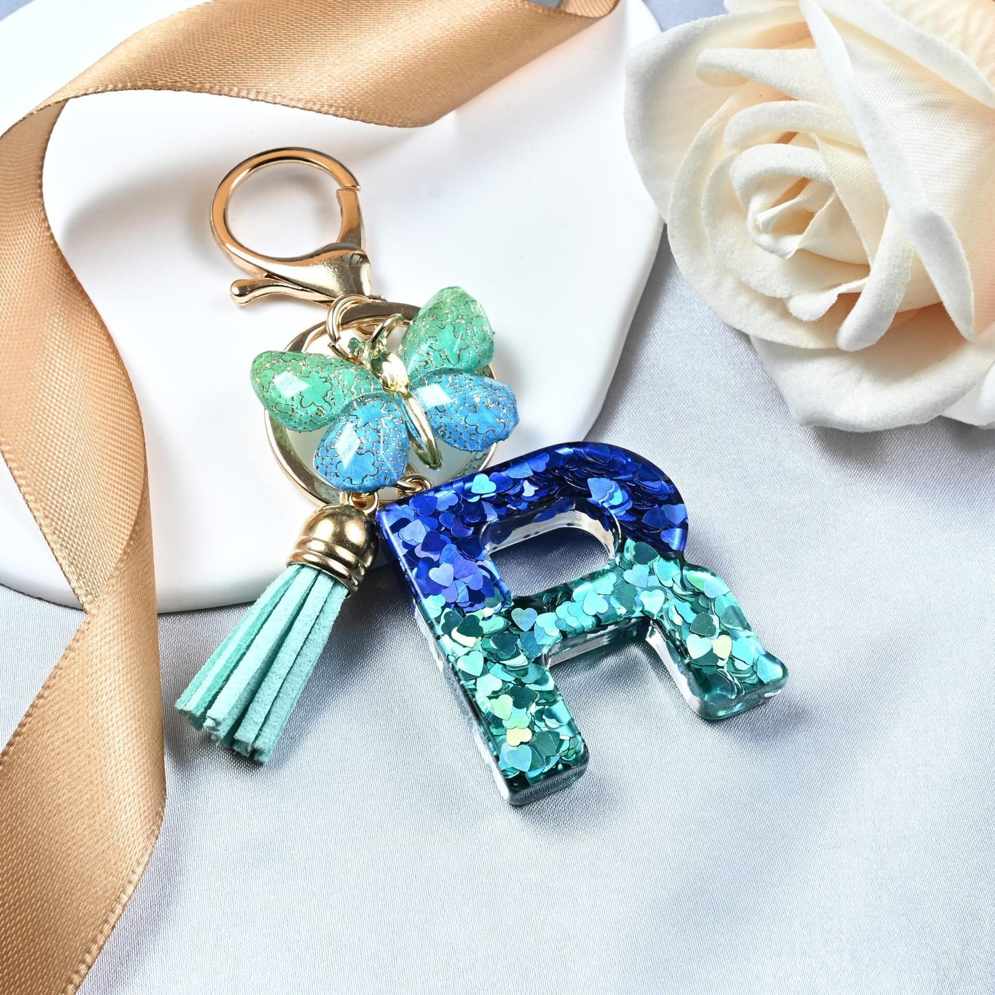 Blue-Green Resin Initial Keychain – Butterfly & Tassel Charm Gift