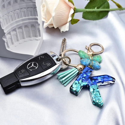 Blue-Green Resin Initial Keychain – Butterfly & Tassel Charm Gift