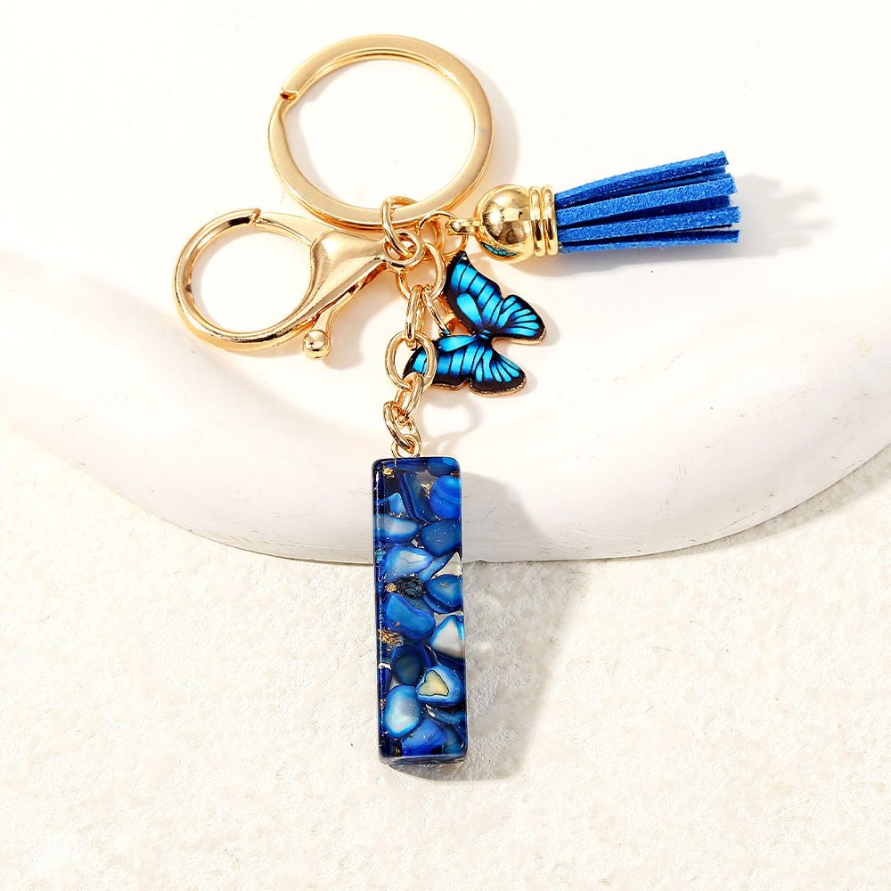 Blue Glitter Resin Initial Keychain – Butterfly & Tassel Charm