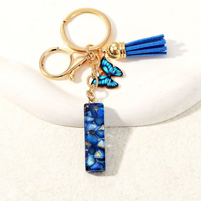 Blue Glitter Resin Initial Keychain – Butterfly & Tassel Charm