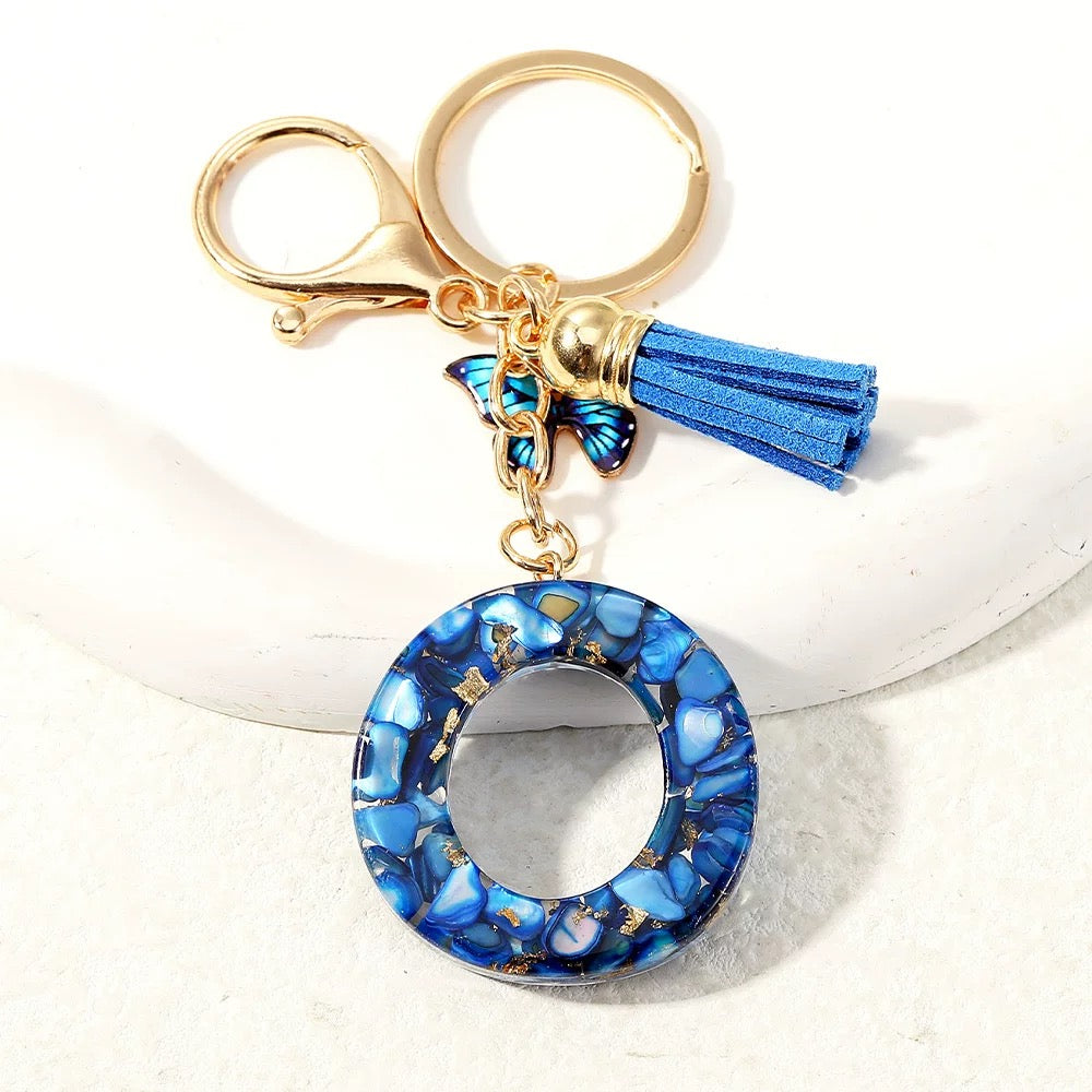 Blue Glitter Resin Initial Keychain – Butterfly & Tassel Charm