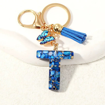 Blue Glitter Resin Initial Keychain – Butterfly & Tassel Charm